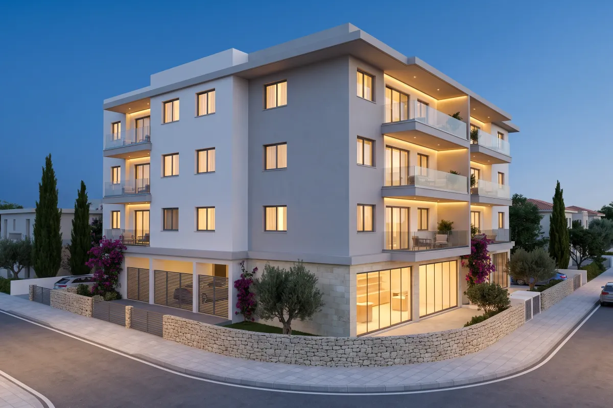 Four-storey corner building with a glazed commercial unit at street level and three floors of apartments above