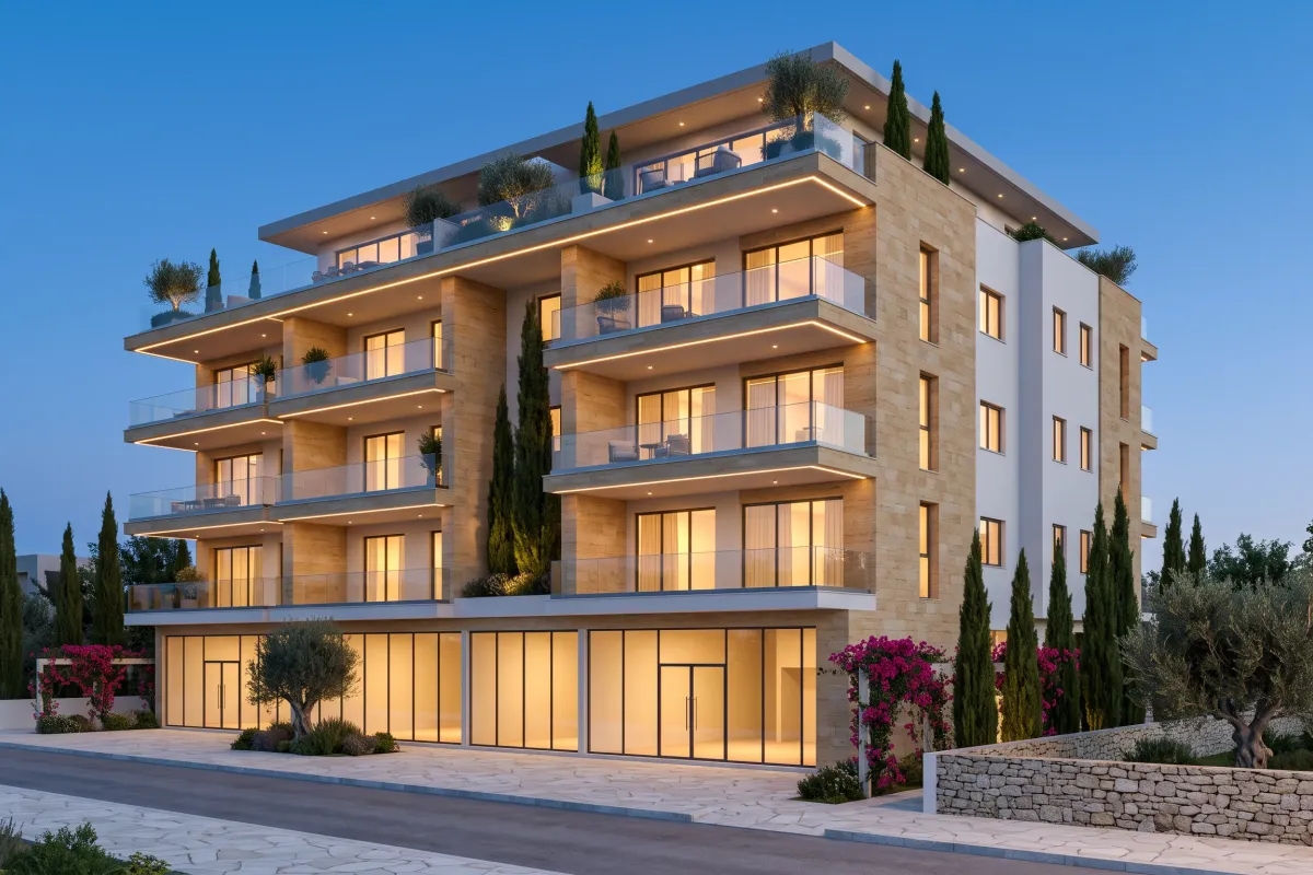 Five-storey mixed-use building with shops and a café at street level, deep lit terraces above and a planted roof terrace