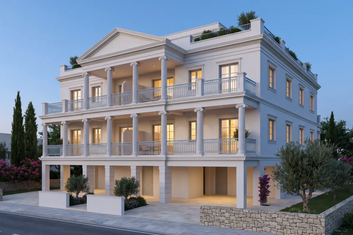Three-storey white classical apartment building with a two-storey colonnade over covered parking, balustraded balconies and a central pediment