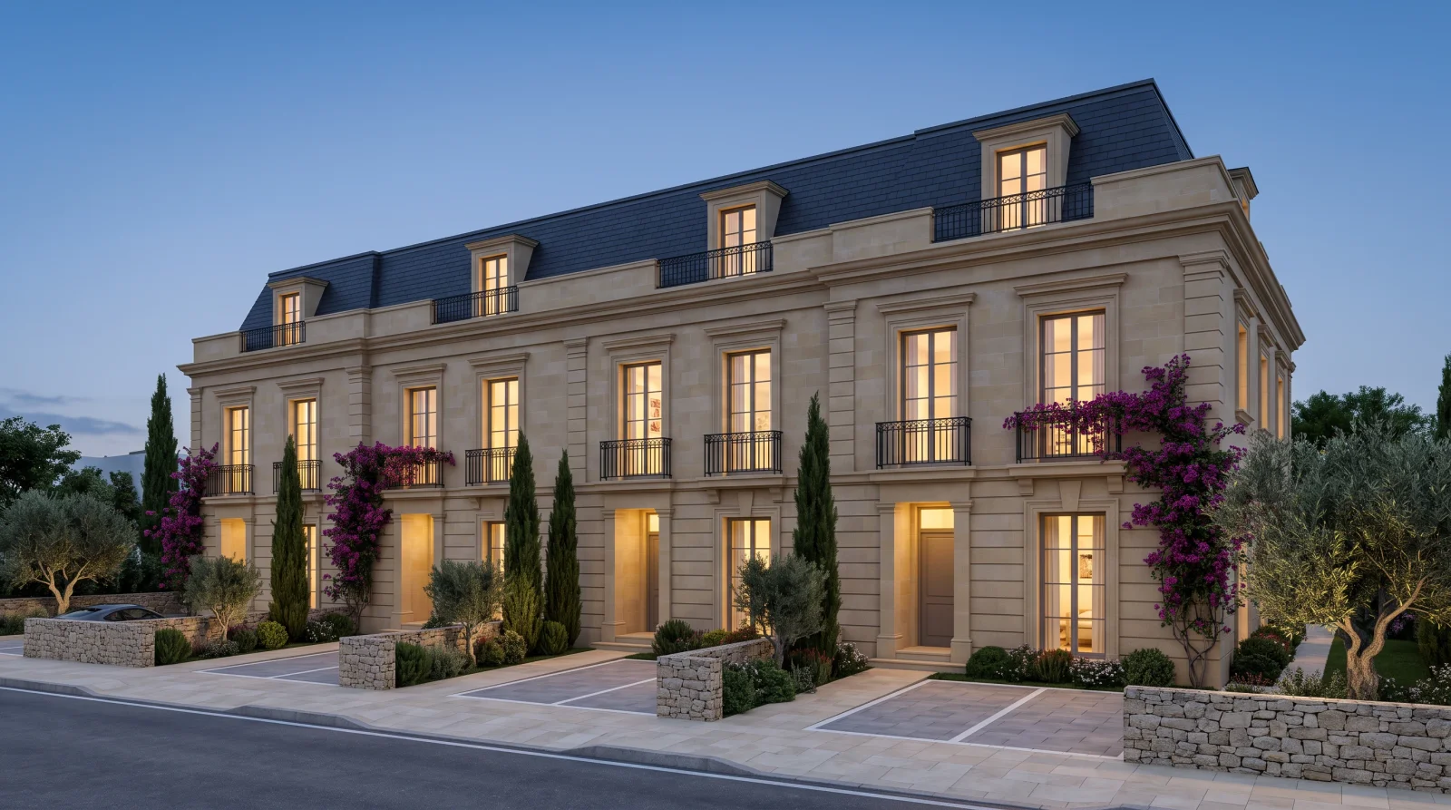 Boulevard Townhouses — the dormered mansard and the iron balconies at dusk